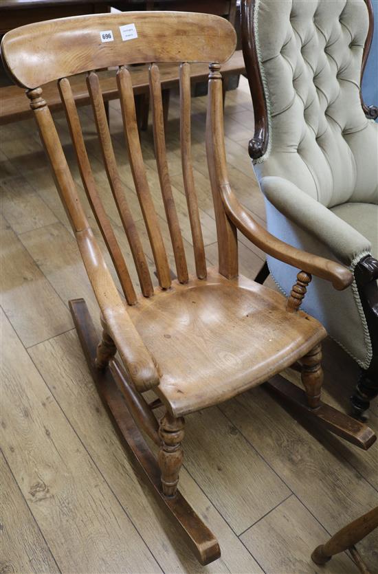 A Victorian mahogany rocking chair